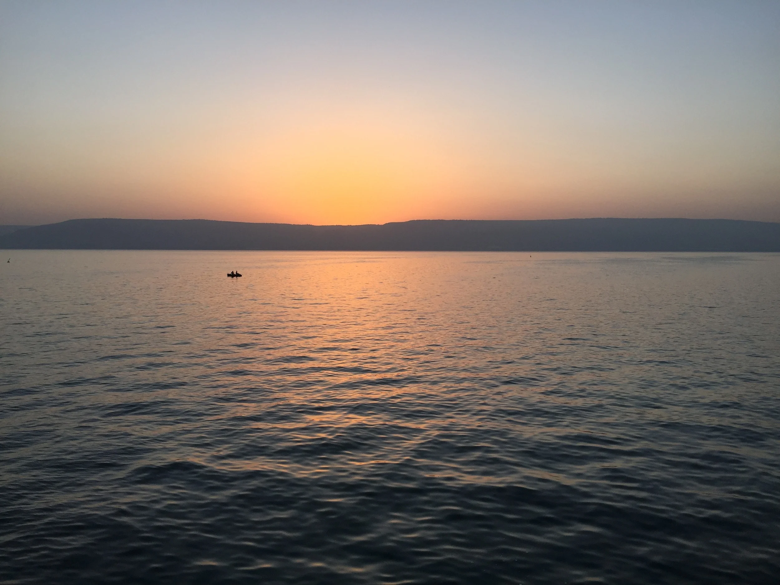 Fishermen on Galilee as we waited for the sunrise.