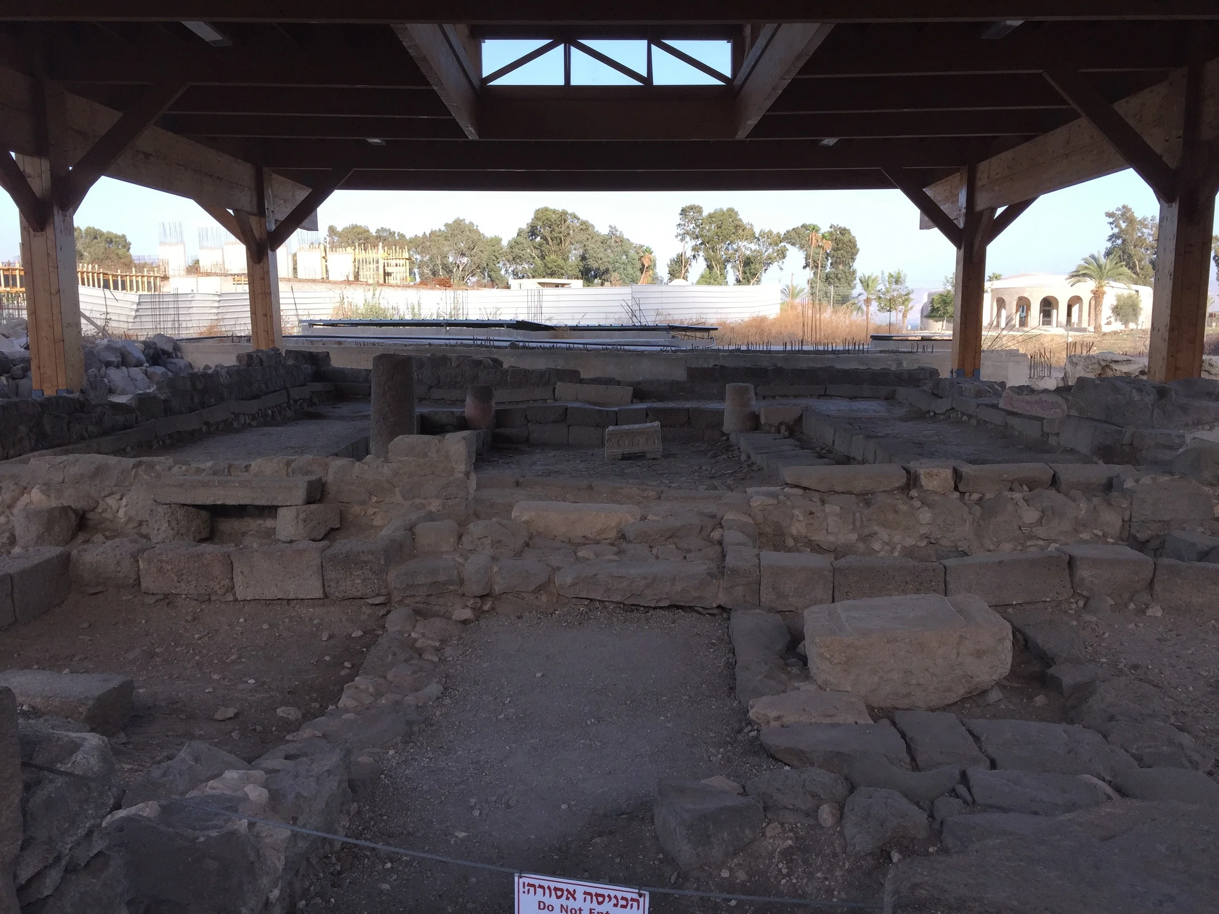 It is most likely that Jesus taught in this synagogue. In the right foreground is a scroll stone. The trenches on either side would have held the dowels of the scroll open for the reader. In the center of the background is a replica of the Magdala Stone inside the synagogue.