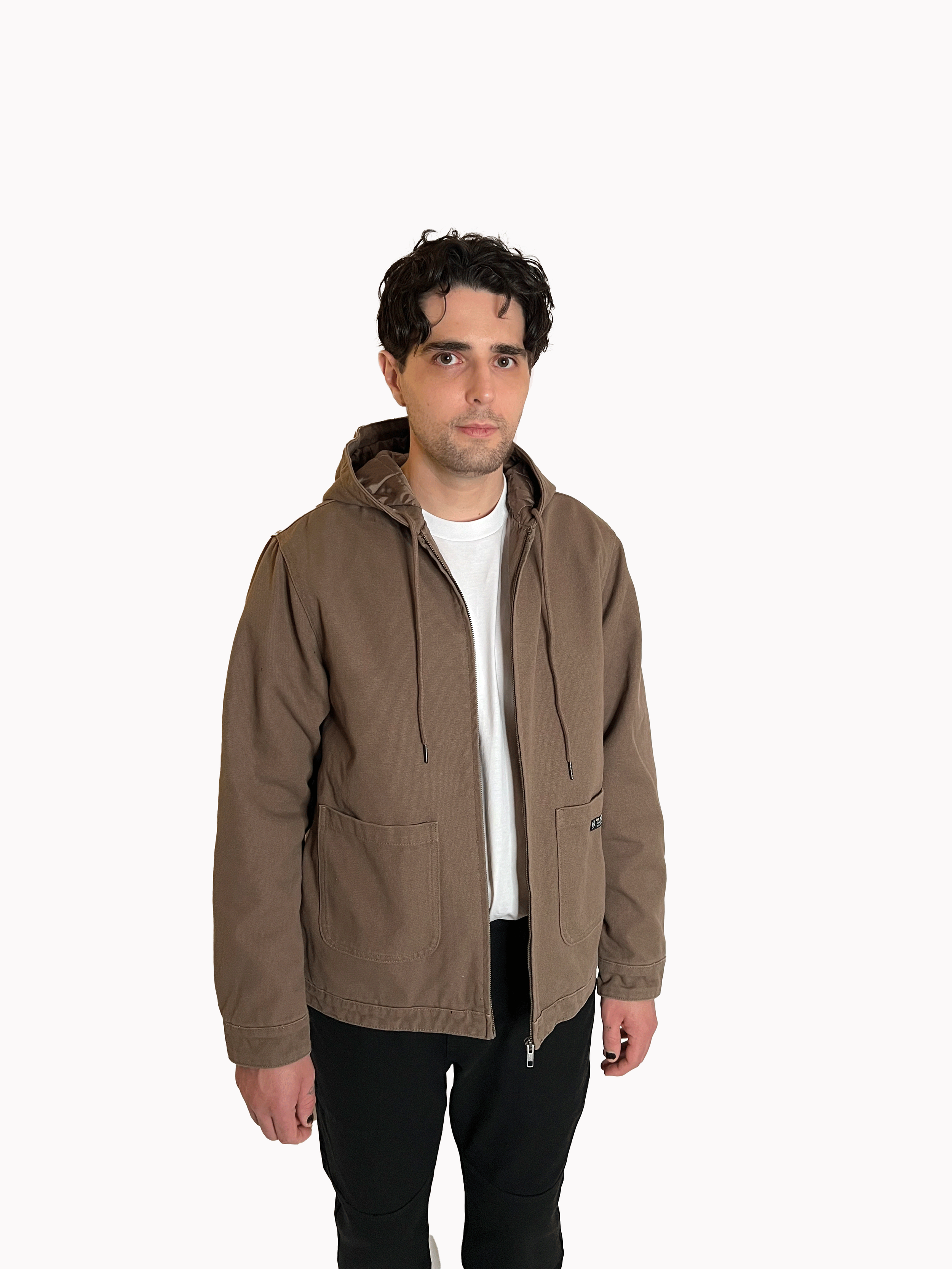 Front view of The SellOut Heavyweight Hooded Canvas Jacket in walnut brown, 13.8 oz duck canvas with quilted recycled lining.