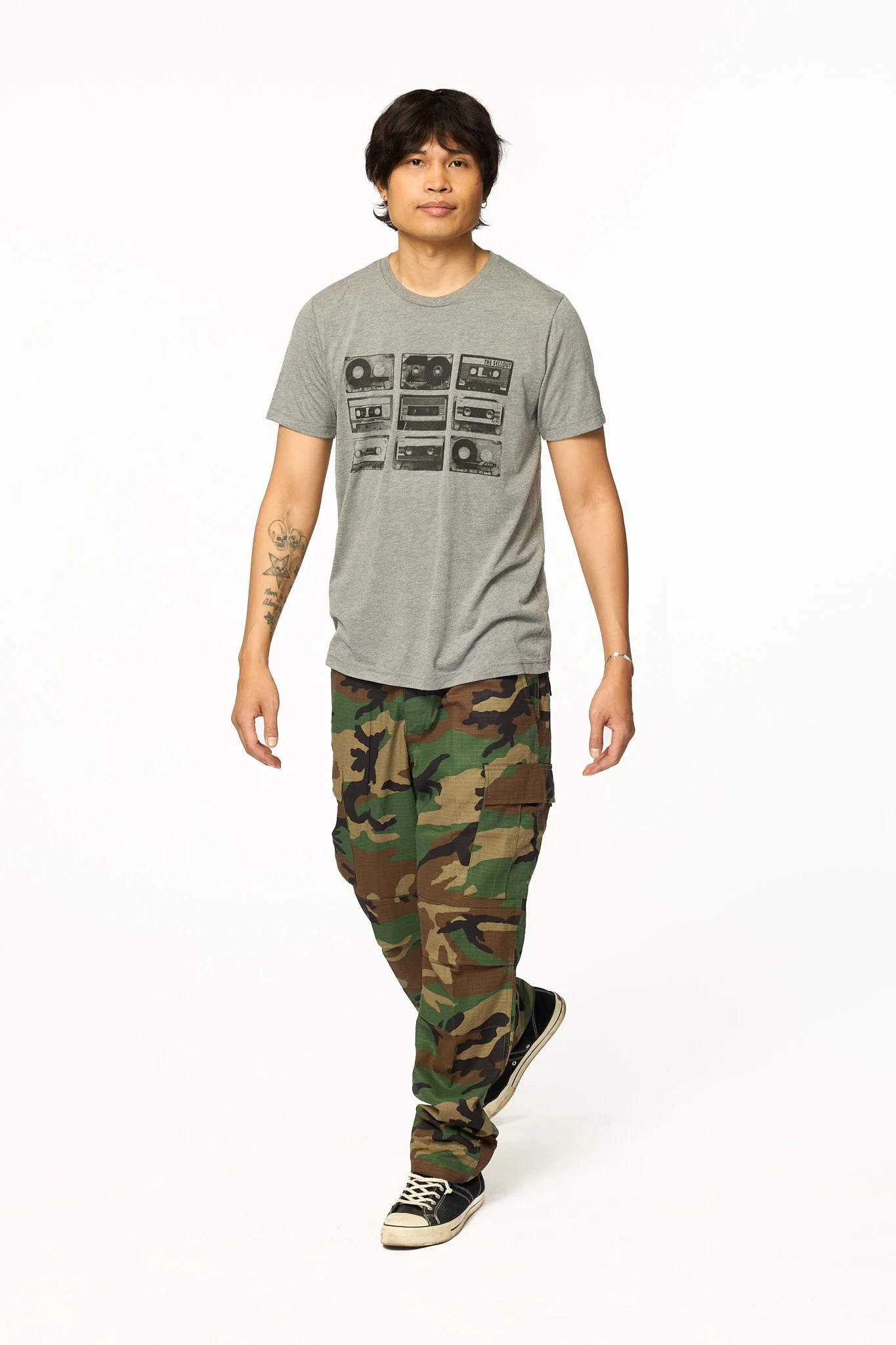 Gray cassettes graphic triblend t-shirt front view with relaxed unisex fit with model walking