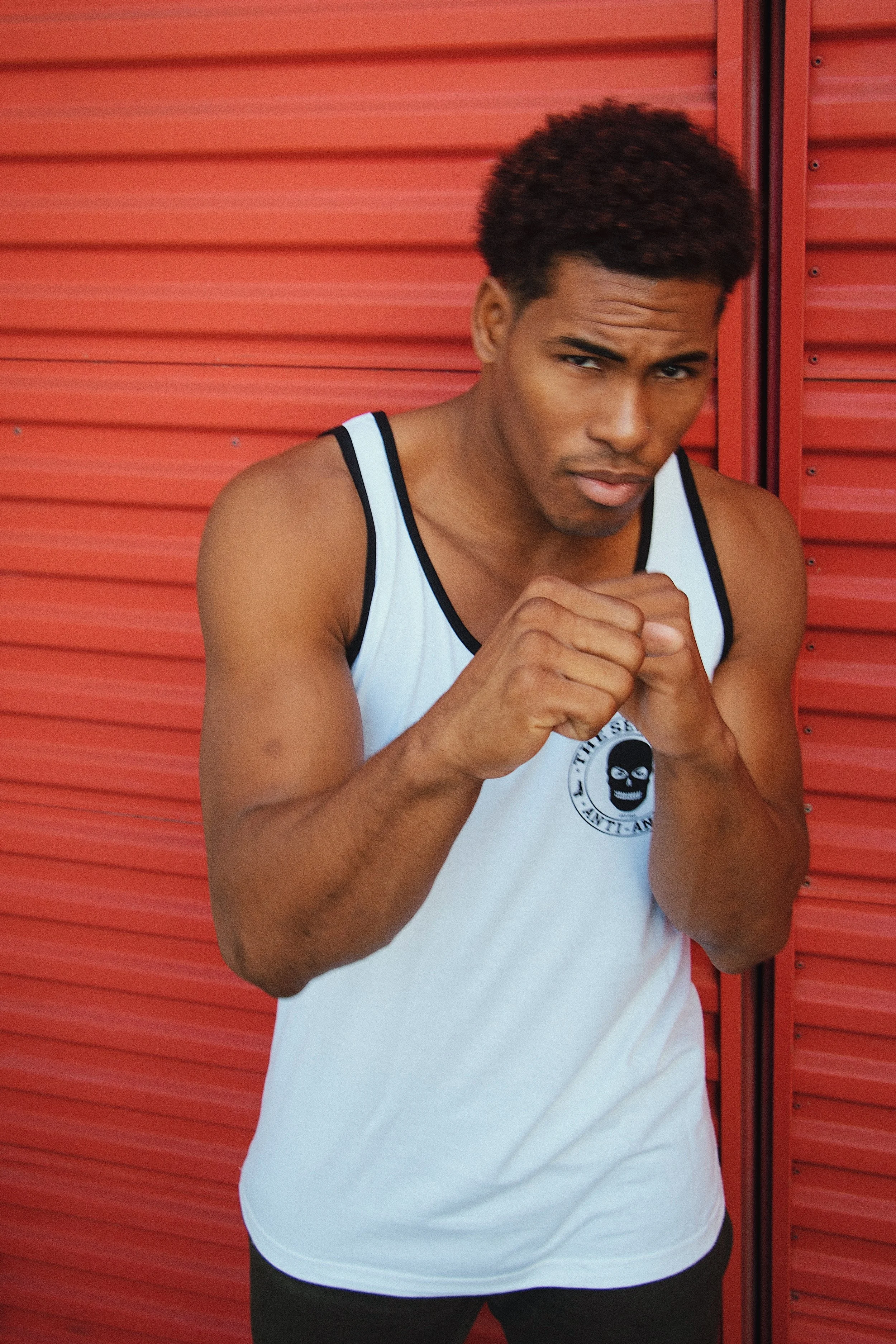 The SellOut Vigilante Unisex Tank Top. Print on front and back.