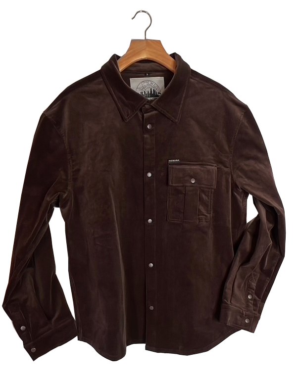 Close-up of brown corduroy fabric texture and pocket stitching on The SellOut shirt jacket.