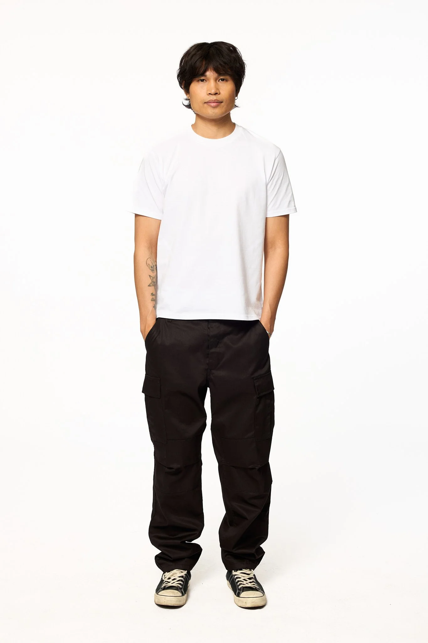 Black solid cargo pants relaxed fit front full body view with white t-shirt