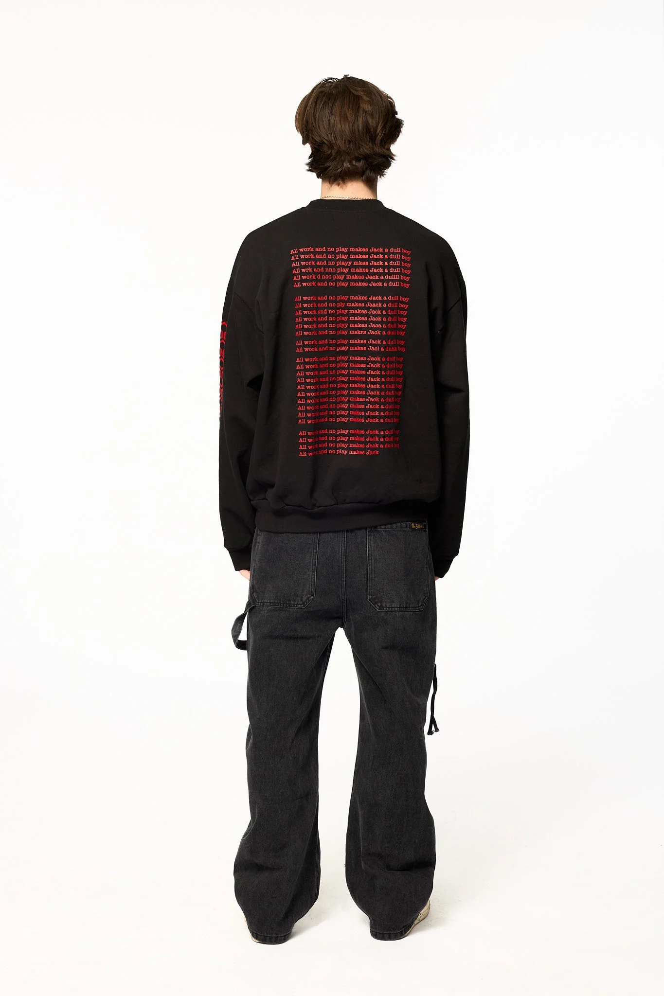 Black The Shining crewneck sweatshirt back view showing repeated red text inspired by The Shining