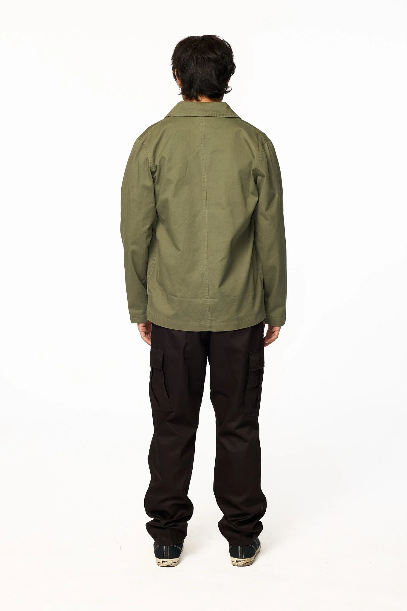 Green chore jacket back view showing clean structure and fit