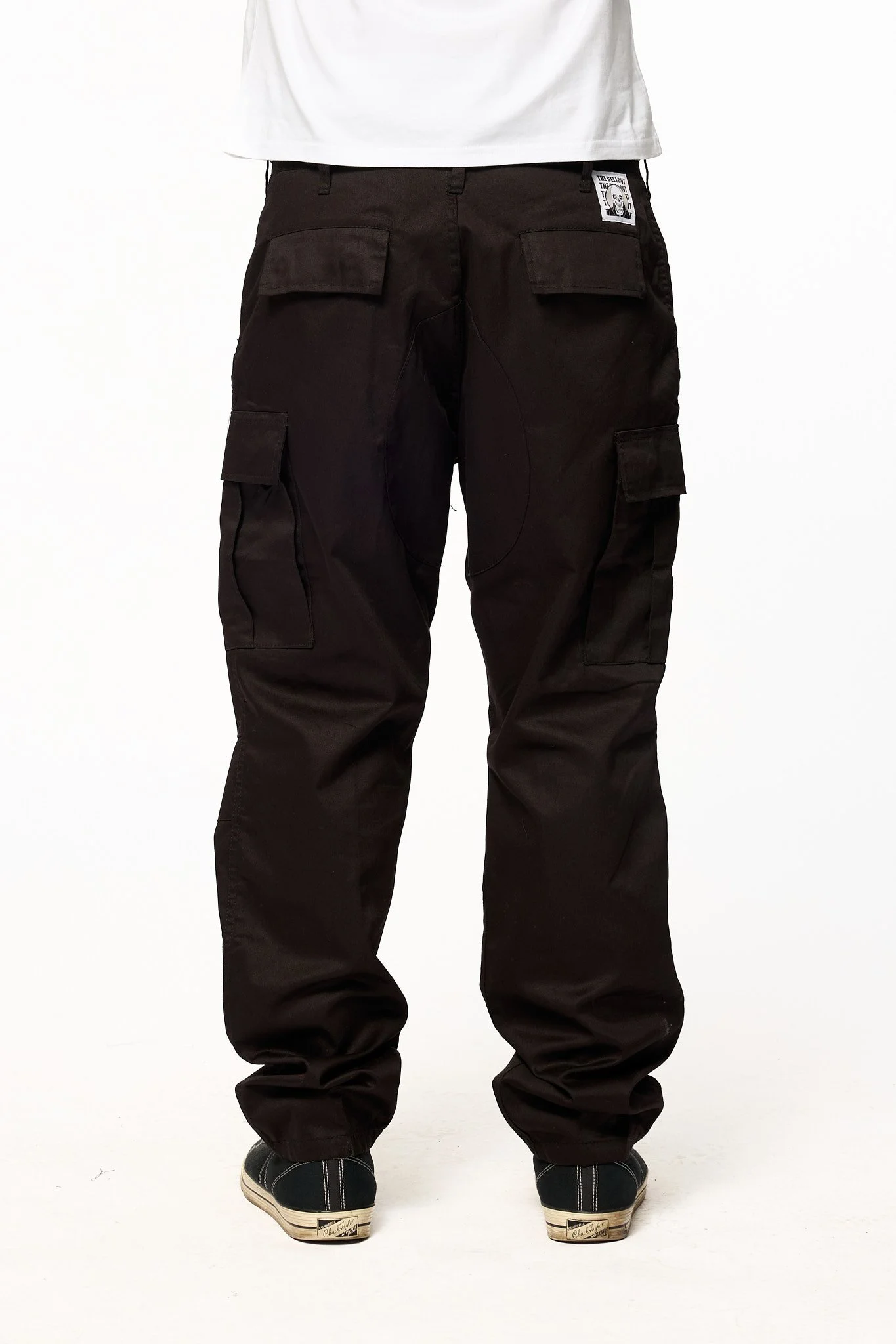 Black cargo pants back detail with pockets and The SellOut label