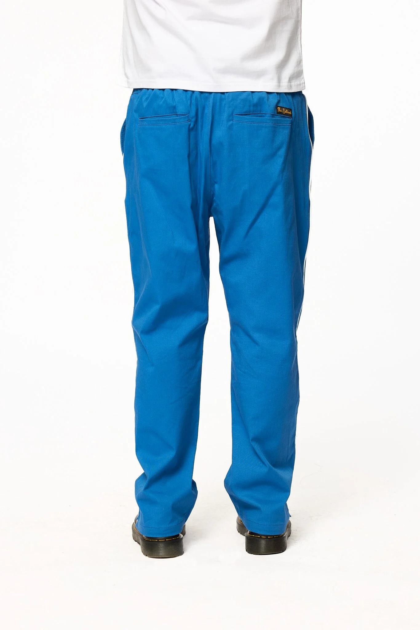 Detail of back shot of royal blue piped pants by The Sellout