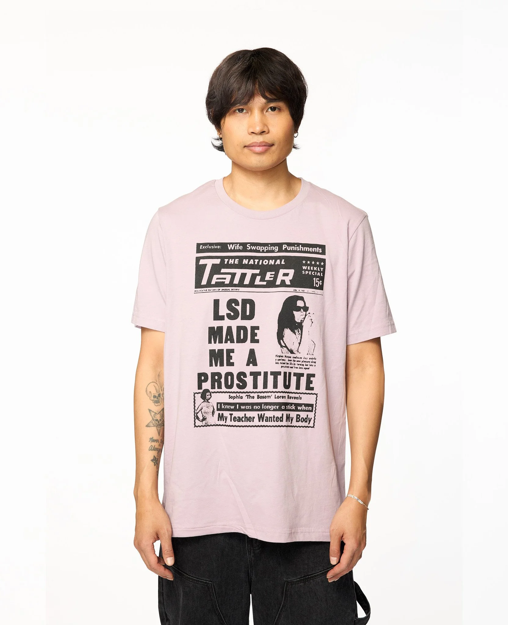 Pink Tattler graphic t-shirt close-up showing tabloid print detail and typography