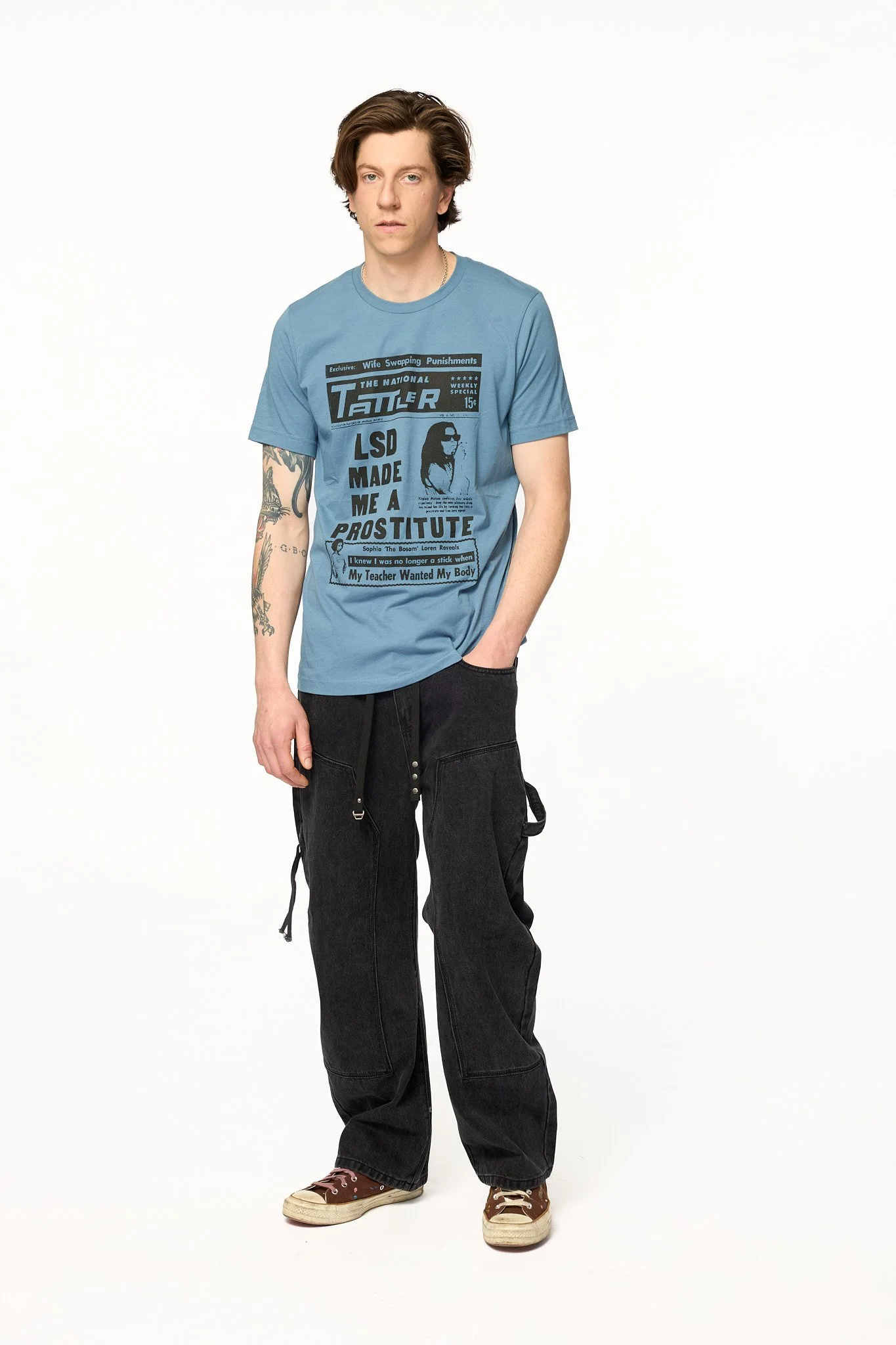 Blue Tattler graphic t-shirt front view showing tabloid print and unisex fit