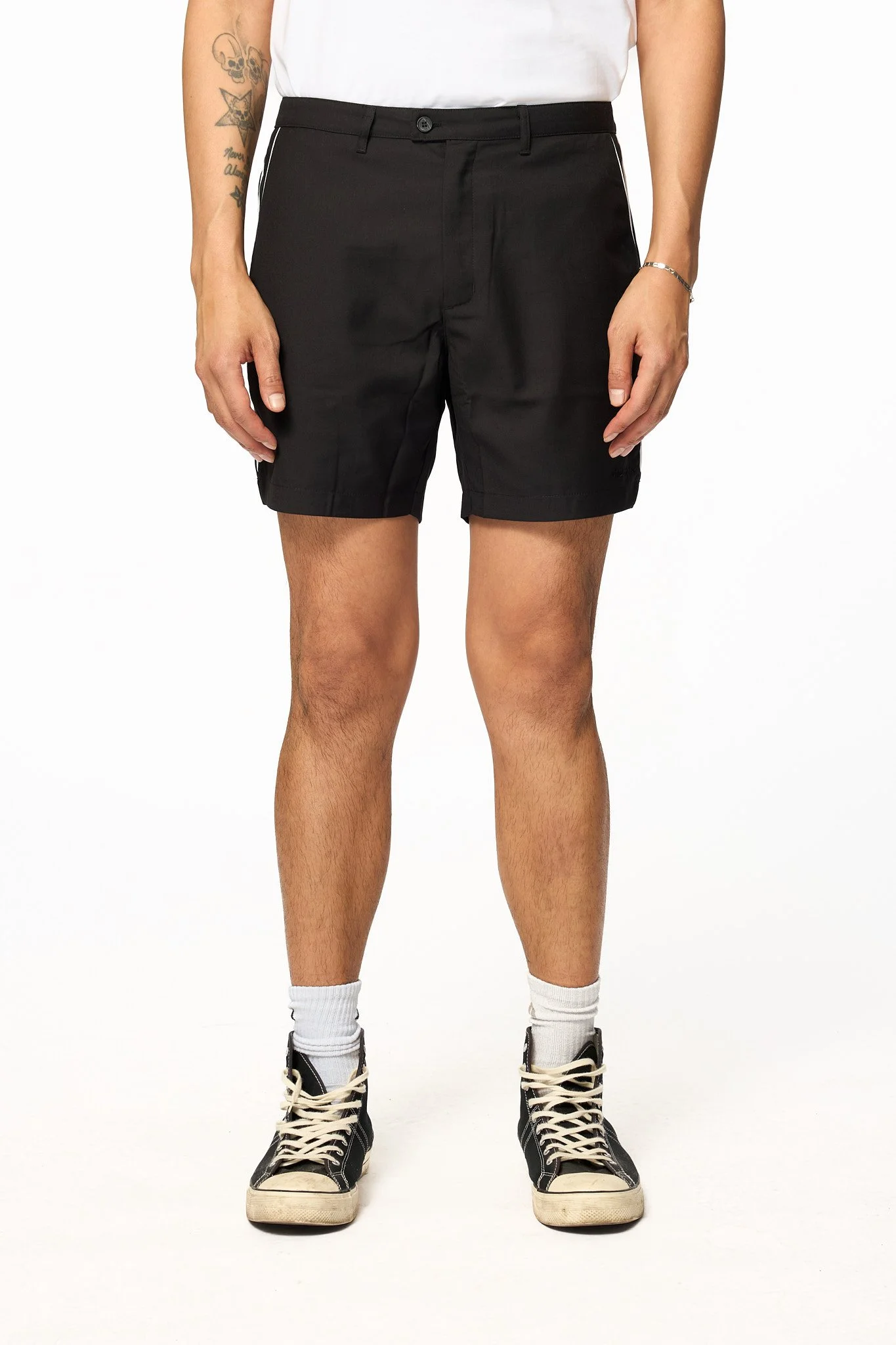 Black piped shorts front detail showing clean waistband and tailored fit