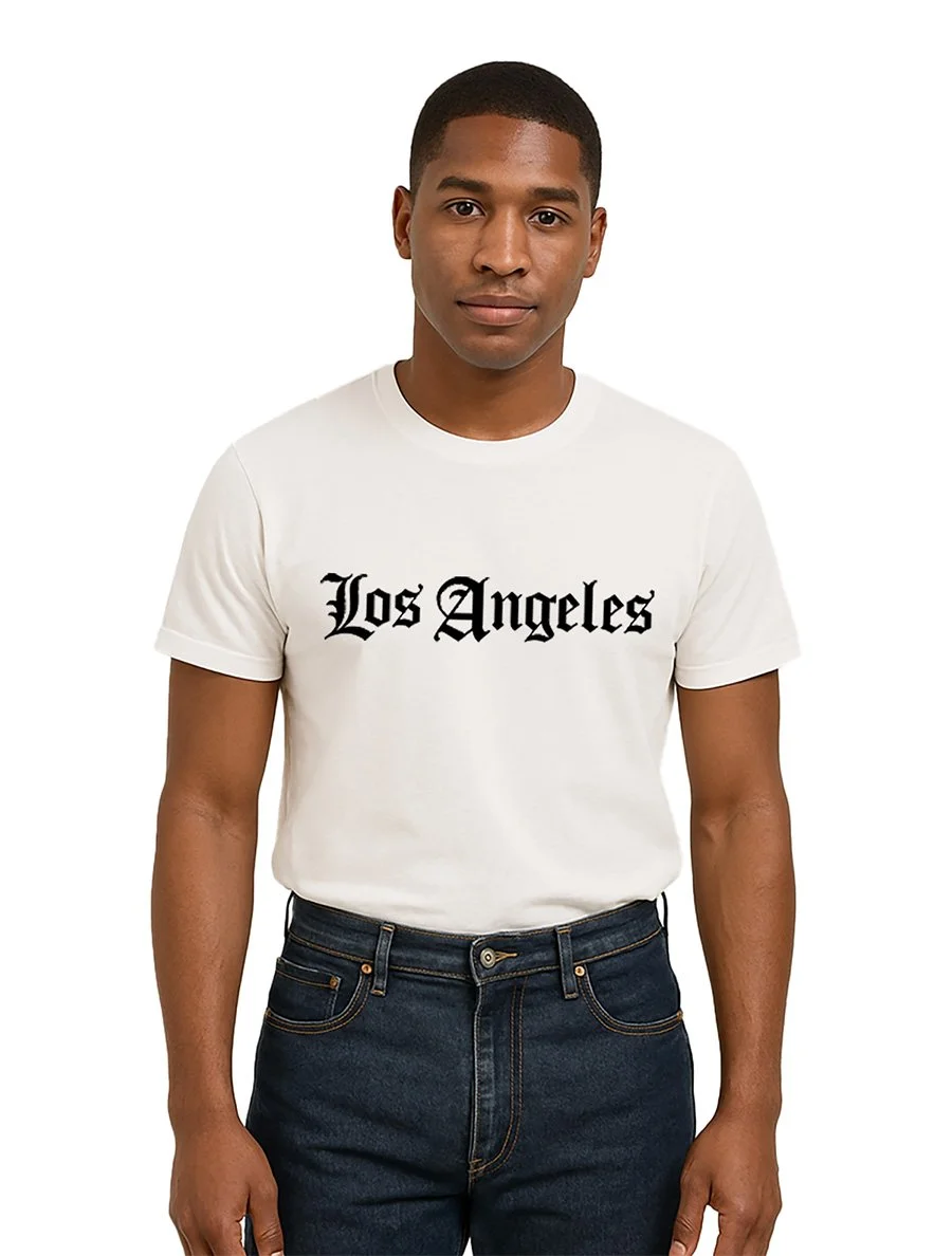 Front view of the Classic Los Angeles Crewneck T-Shirt by The SellOut, shown in black on a plain white background. Regular fit, crewneck, 100% combed cotton. Available in multiple colors.