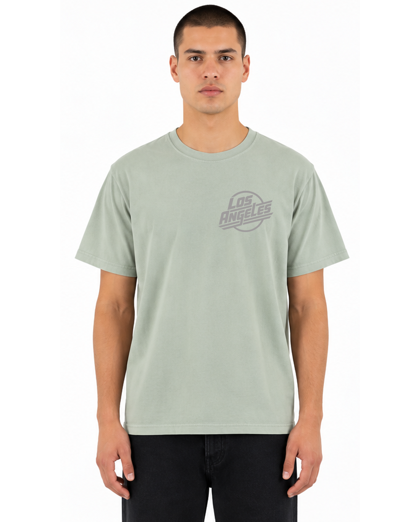 Male model wearing The SellOut Los Angeles Logo Tee in vintage wash light green, front view