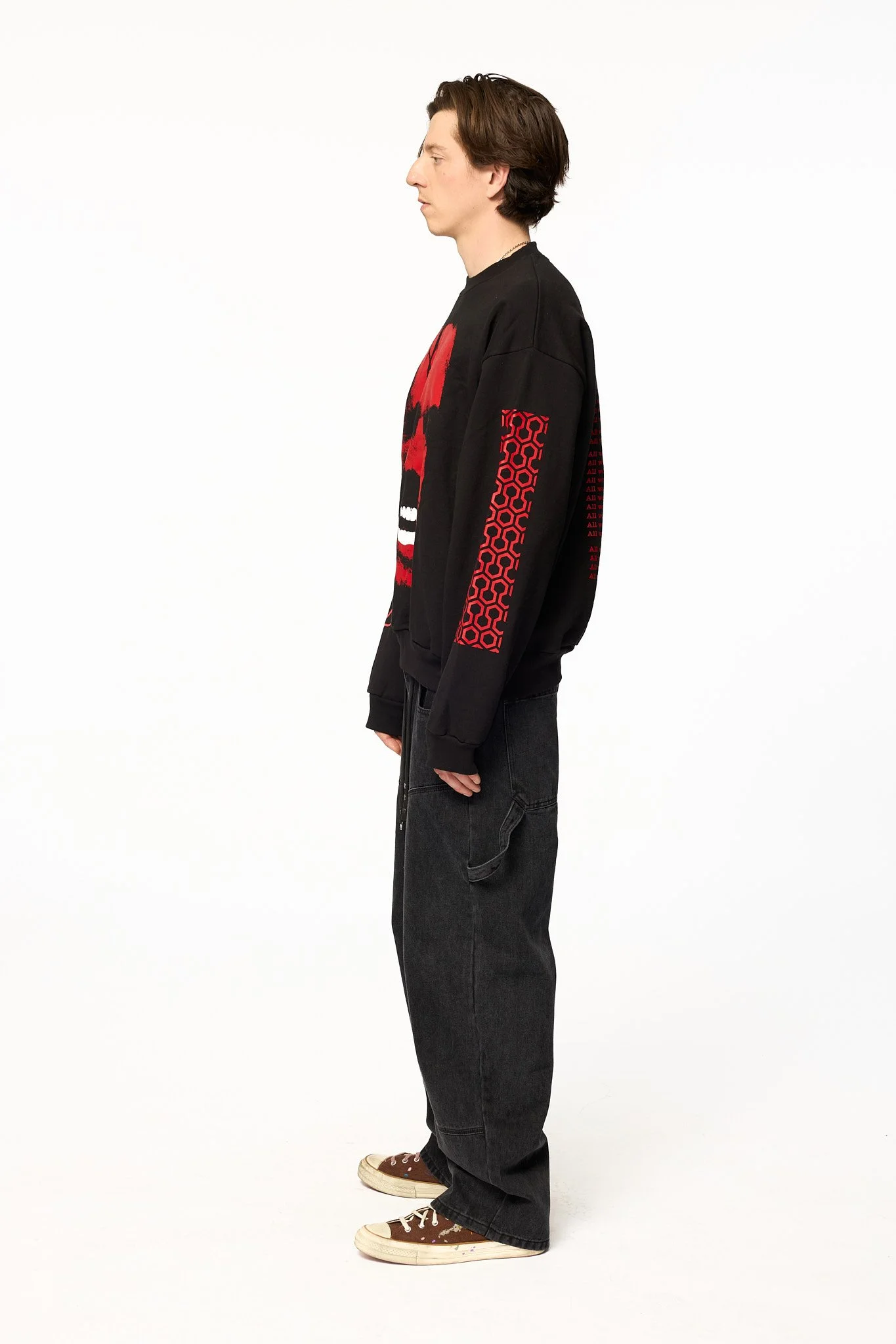 Black The Shining crewneck sweatshirt side view showing sleeve graphics and relaxed fit