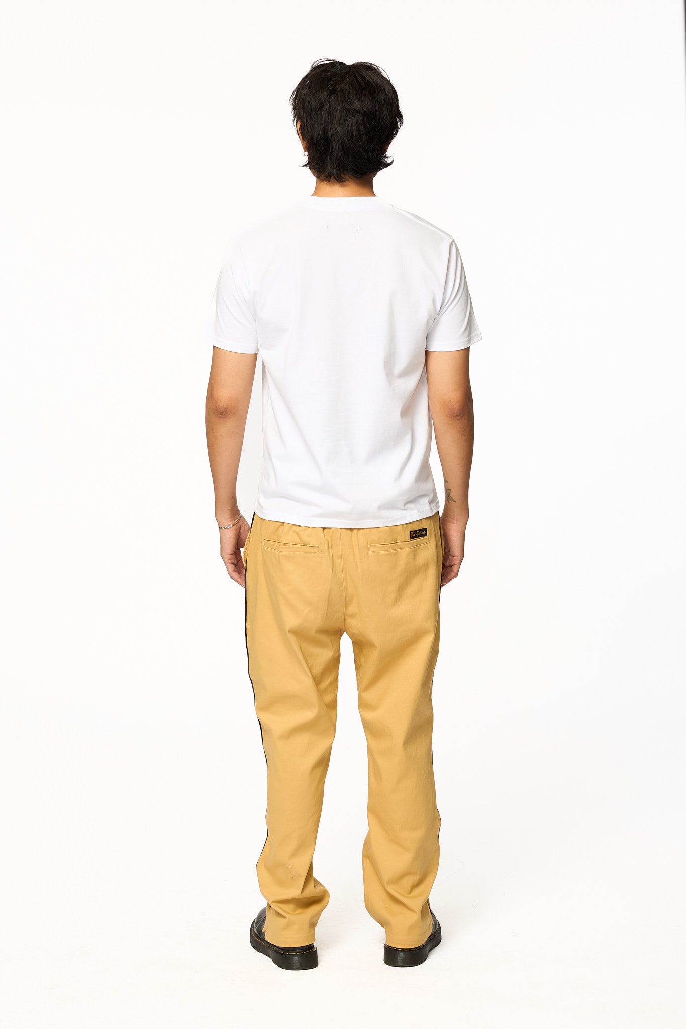 Back view of khaki piped pants by The Sellout