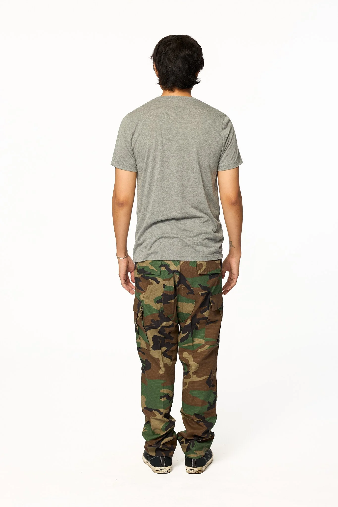 Vintage wash camo cargo pants back view with flap pockets and relaxed fit