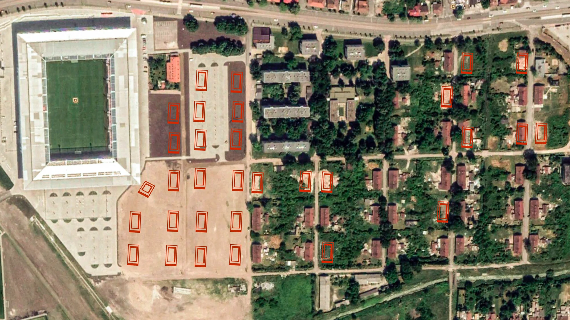 After: A satellite shot from 2018 shows the new stadium with a parking lot and empty fields where 20 houses once stood. The city continues to evict Roma as they can, and tear down homes far from the stadium, as the red rectangles — destroyed and partially destroyed homes — throughout the Numbered Streets indicate.
