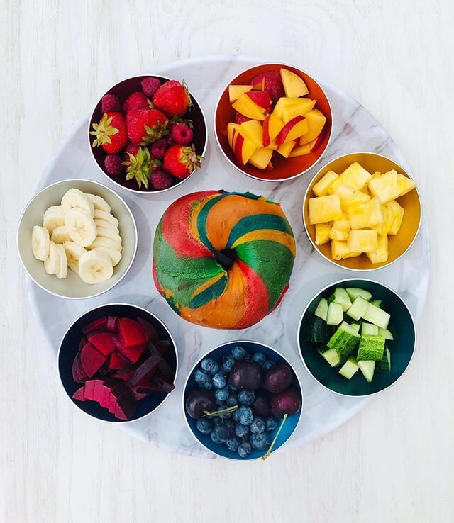 🌈🍭🌈🍭🌈🍭made a fun breakfast this morning: pride bagels and a rainbow of fruit. Here&rsquo;s to starting off the week with some fun food.