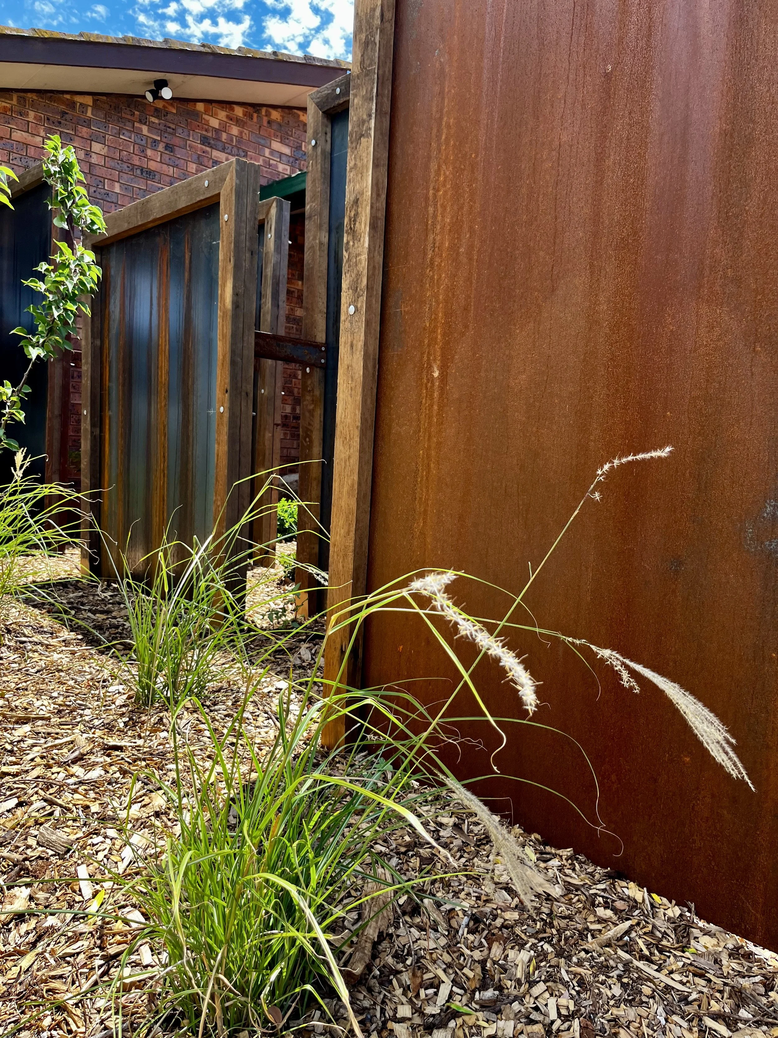 Steel and hardwood timber privacy screen structure