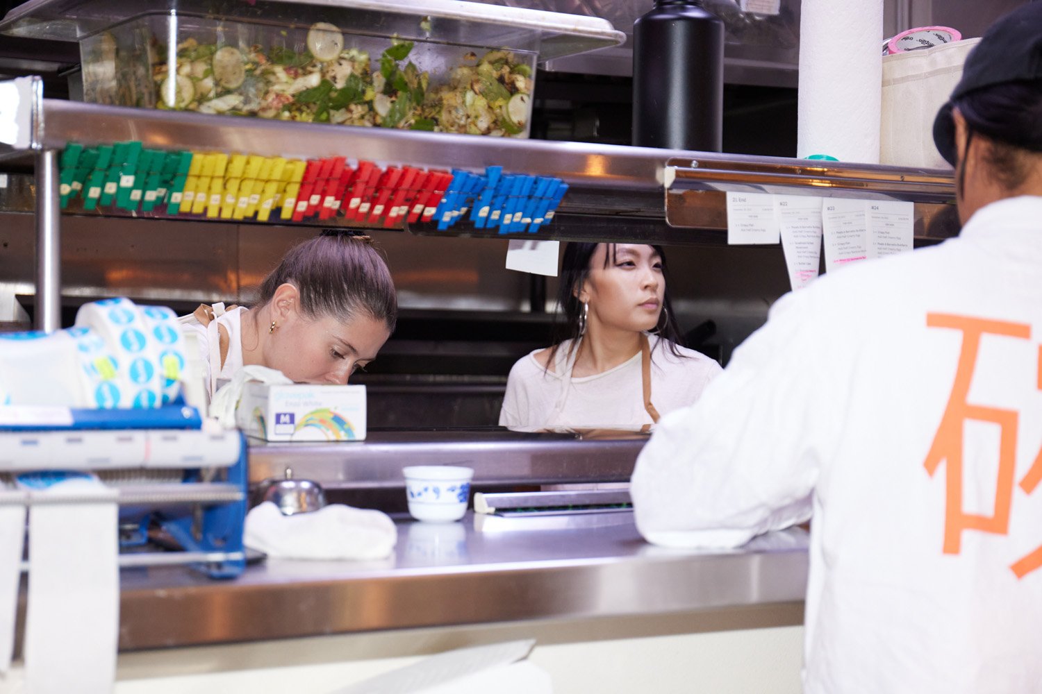 People working in a restaurant kitchen