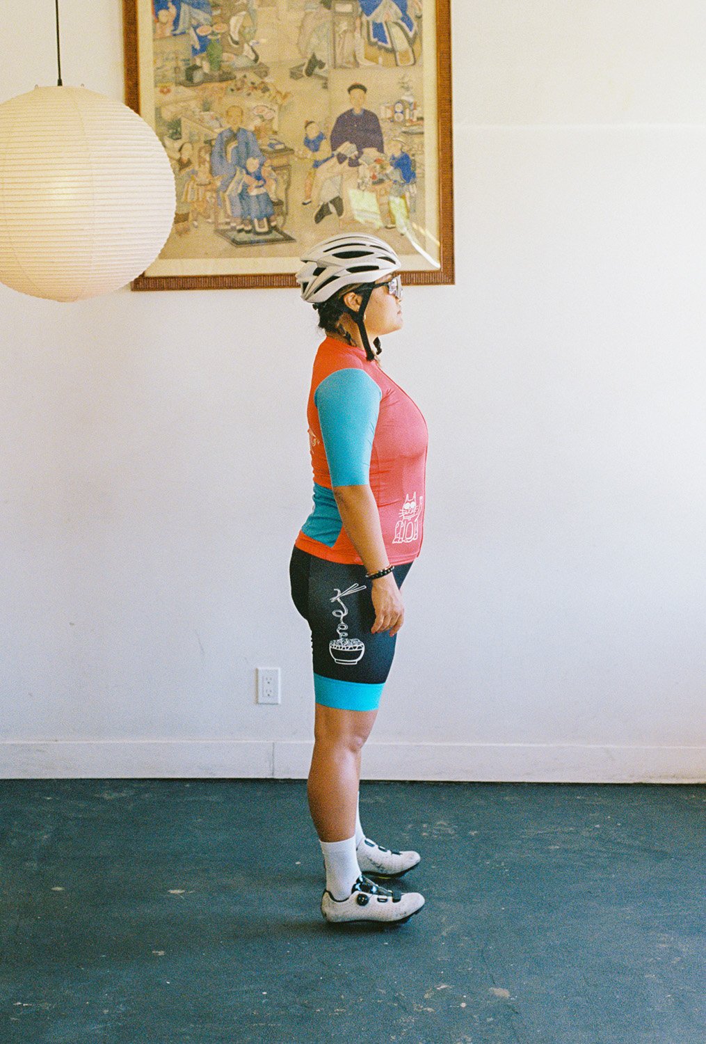 A woman wearing a cycling uniform