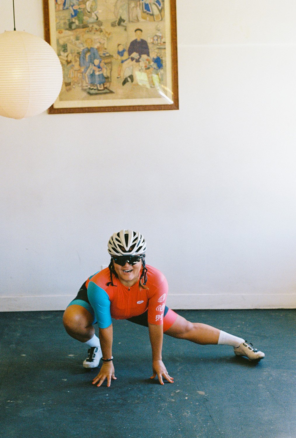 A woman posing in a cycling outfit
