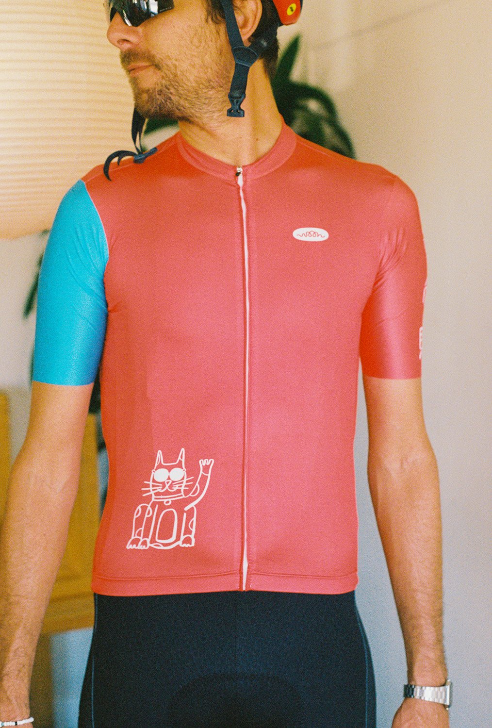 A man wearing a cycling jersey