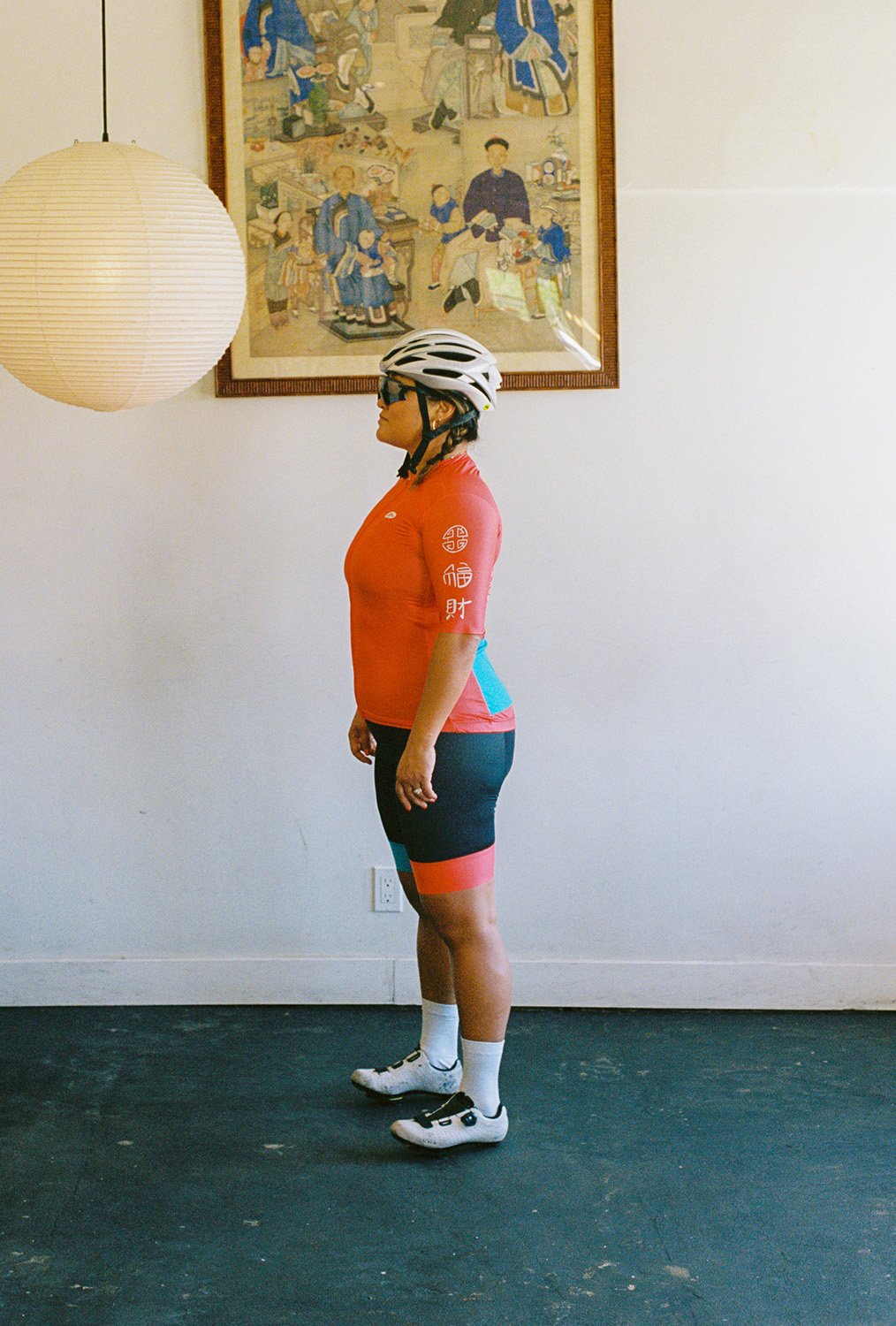 A woman wearing a cycling uniform