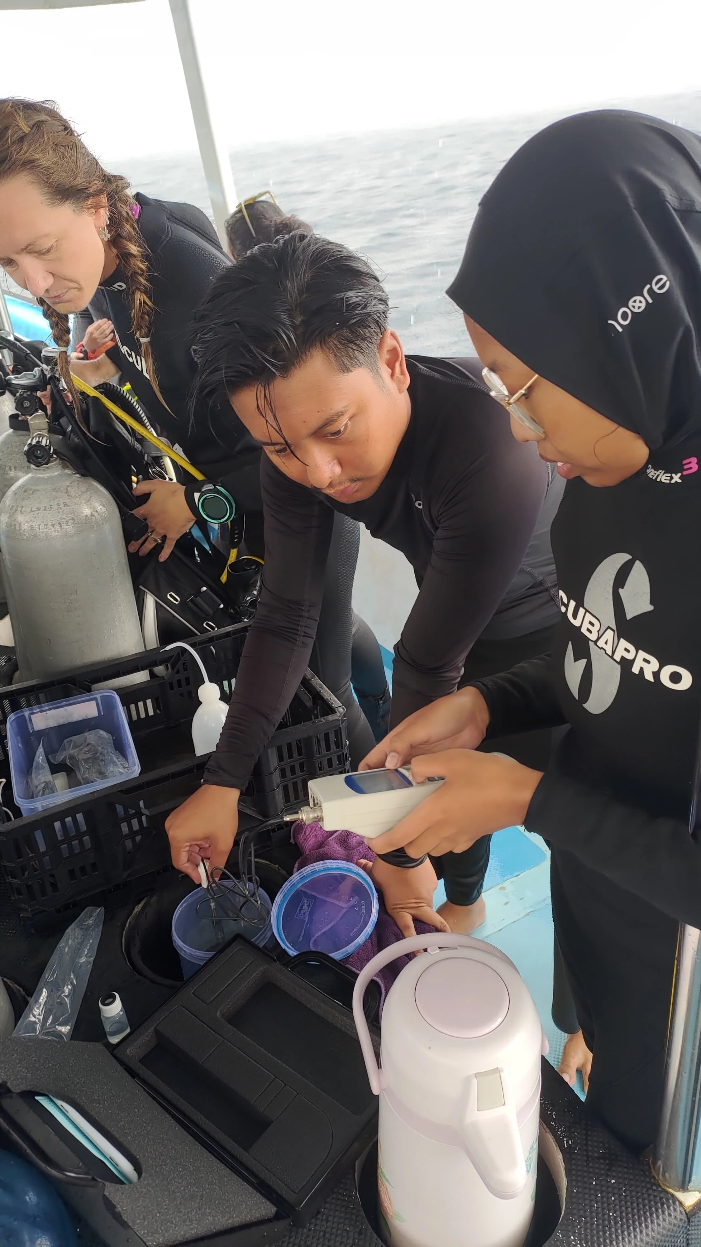 Indonesian research students coral restoration