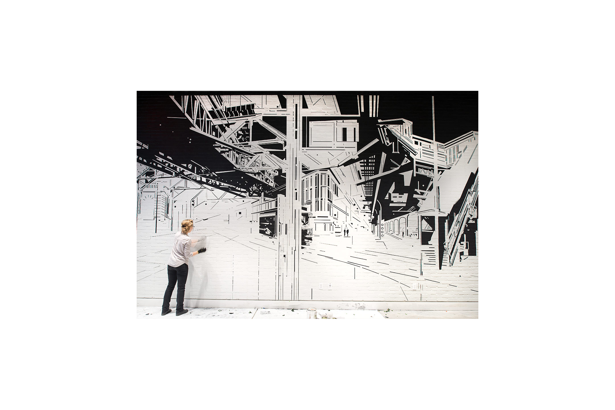 Custom black and white cityscape mural by Brooklyn based artist Margaret Inga Urias. 