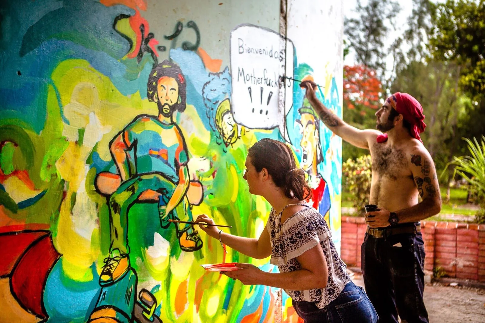 Chris and Katie painting a collaboration mural in Havana. Photo: Scott Furkay.