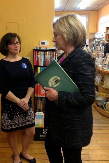 Oh, hey, Hillary Clinton. We see you have a copy of Mike's book. We approve.
