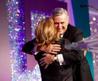 John Young, President and CEO, Energy Future Holdings accepts the Crystal Leadership Award from WBENC President and CEO Pamela Prince-Eason at the WBENC 2012 Summit & Salute. Photography by visionista