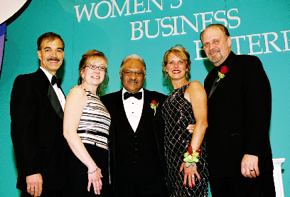 2004 Applause Award Winner Dr. Renaldo Jensen and the Ford Motor Company Supplier Diversity Development Team. From left to right : Andy Benedict, Executive Director, Facilities, Materials & Services Purchasing; Lori Hines, Manager, Supplier Diversity Development; Dr. Jensen; Debbie Murdie, Manager, Supplier Diversity Development; and Steve Larson, Manager, Supplier Diversity Development.