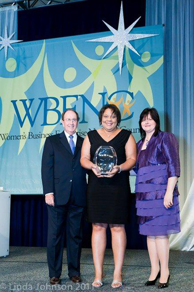 WBENC HONORS ERNST & YOUNG'S THERESA HARRISON (center) WITH WILLIAM J. ALCORN AWARD