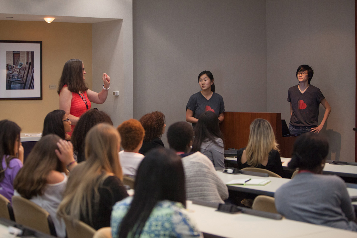 Kay Freund, IBM, speaks to students during their visit to the IBM Innovation Center, with co-founders of Hey Blink Me.