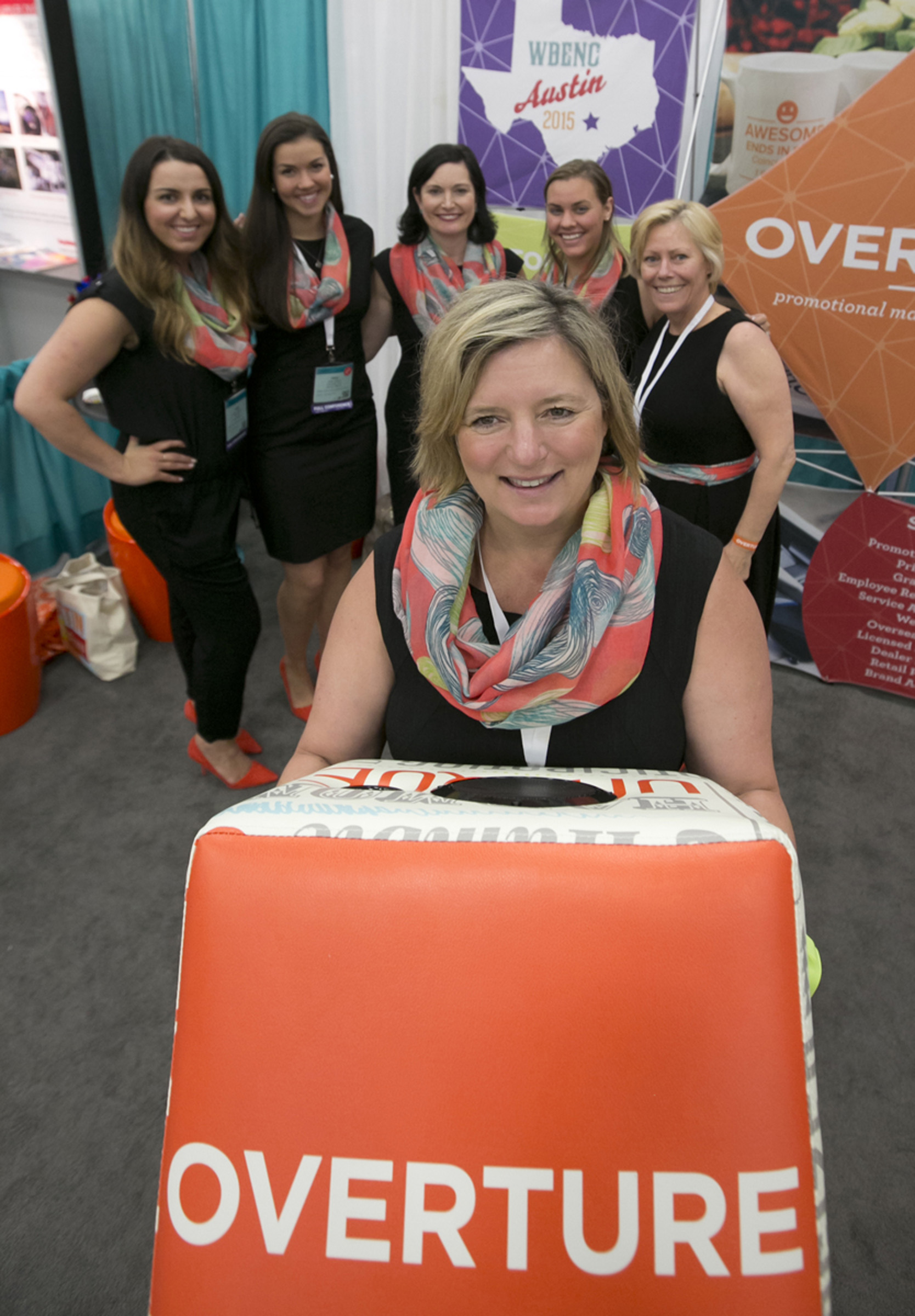 Heather Sanderson, the Founder and CEO of Overature Promotions with her team