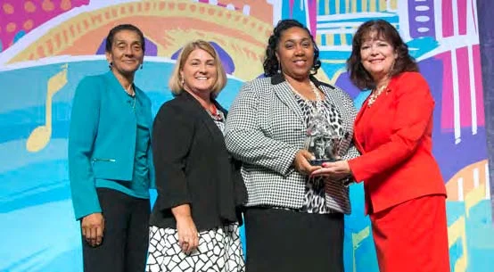 Presenting the Applause Award Left to Right: Benita Fortner, Chair WBENC Board; Pamela Prince-Eason, President & CEO, WBENC; Shari Francis, Merchandising Manager, Tier 2 Diversity Merchant, Office Depot; Kathy Homeyer, Director, Supplier Diversity, UPS