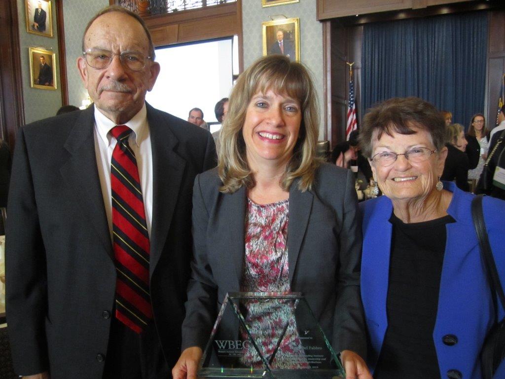 Peggy receiving an award from WBEC PA-DE-sNJ with her parents Charles and Helen Davis,