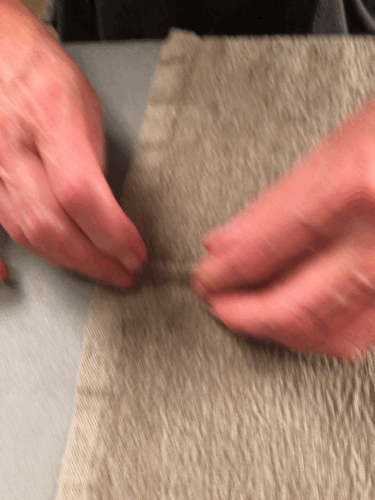 5. Fold top seam allowance over and under 1/4” (.64) trimmed seam.