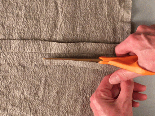 4. Open seam with fingers and trim under seam (front seam) to 1/4” (.64 cm).
