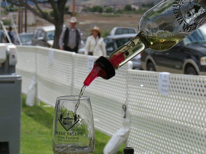 A festival attendee enjoys a sample of Merkin Vineyard's Shinola Blanca.