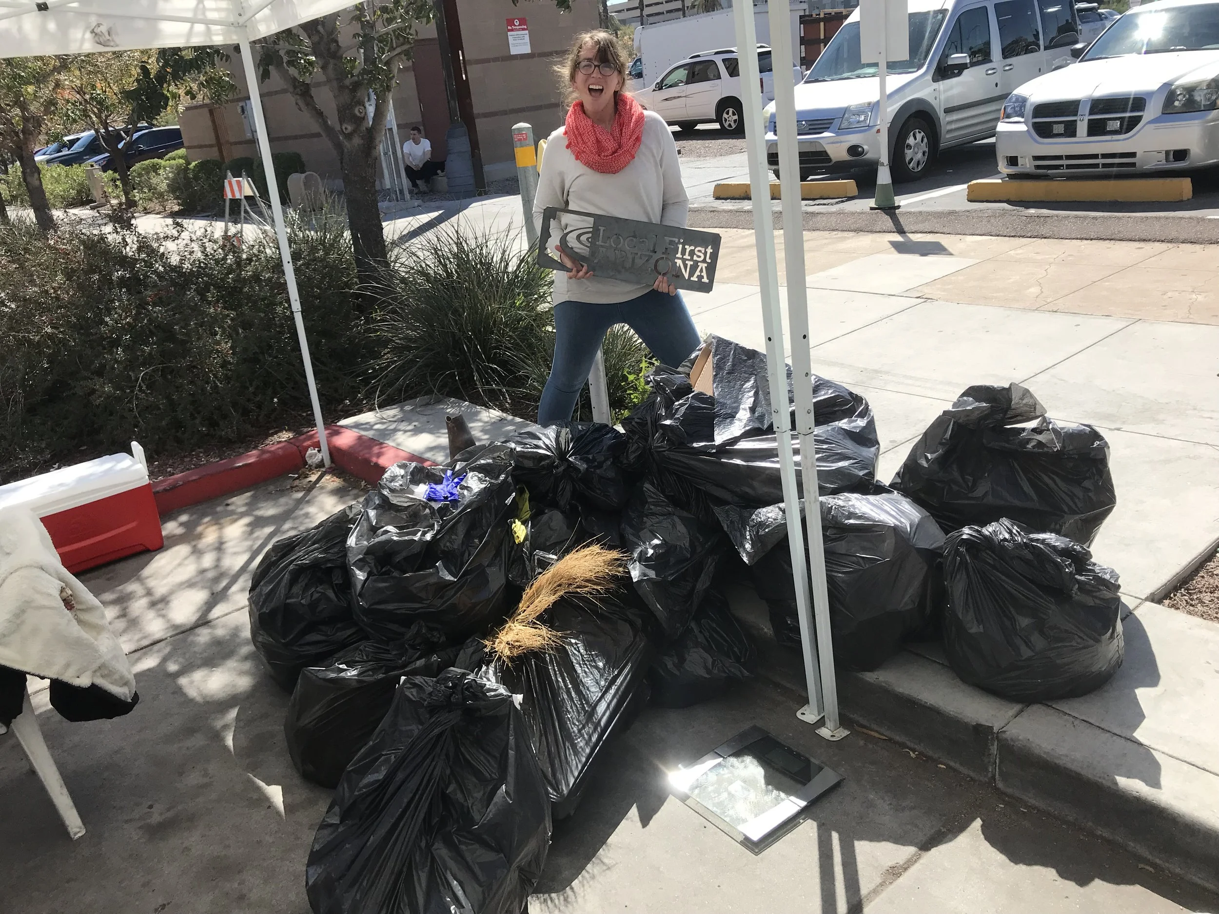 A Green Team member with 125 pounds of waste!
