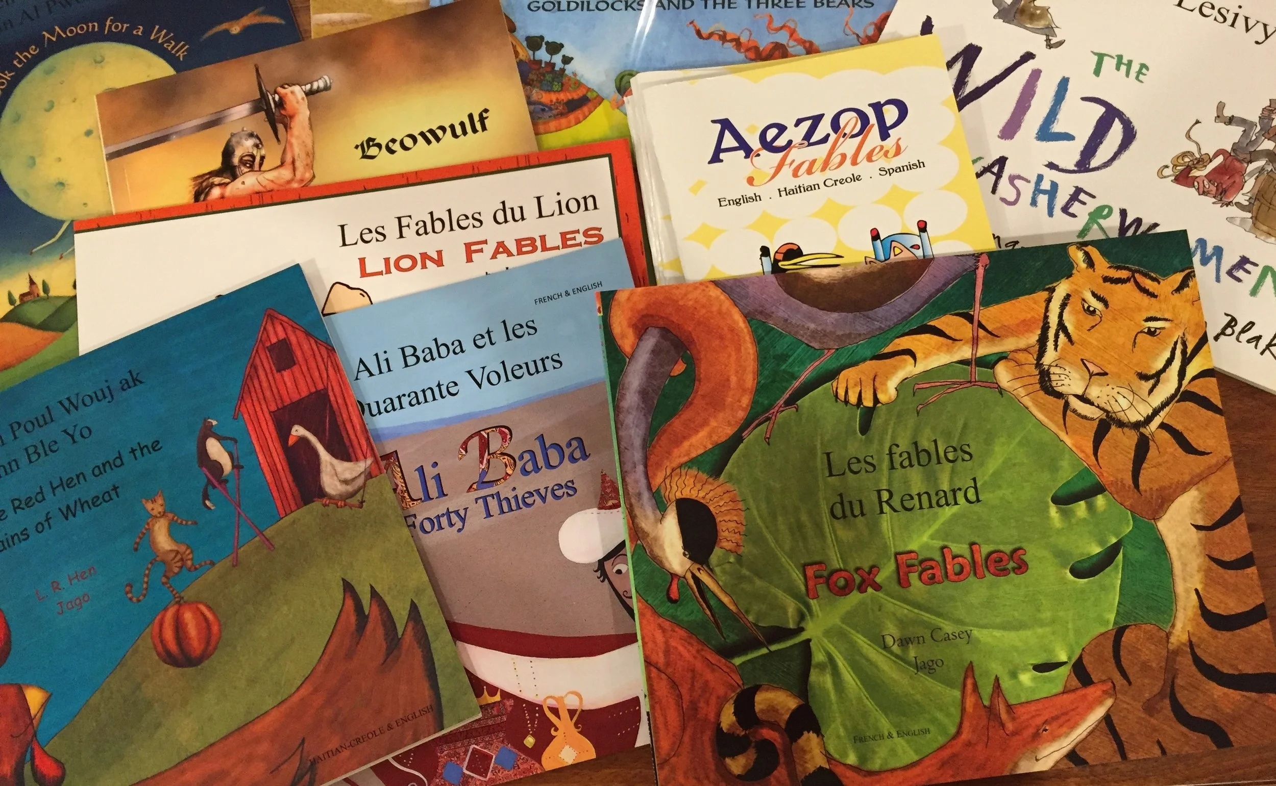 Many of the early readers are in two languages – English & Kreyol or French & Kreyol – with familiar titles designed to expose children to the stories of the world. They will learn about the Little Red Hen, Aesop’s fables and Beowulf.