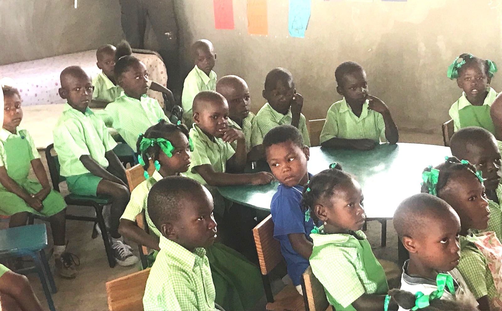 The students listen carefully to the English version of the song they sang to us in Kreyol.