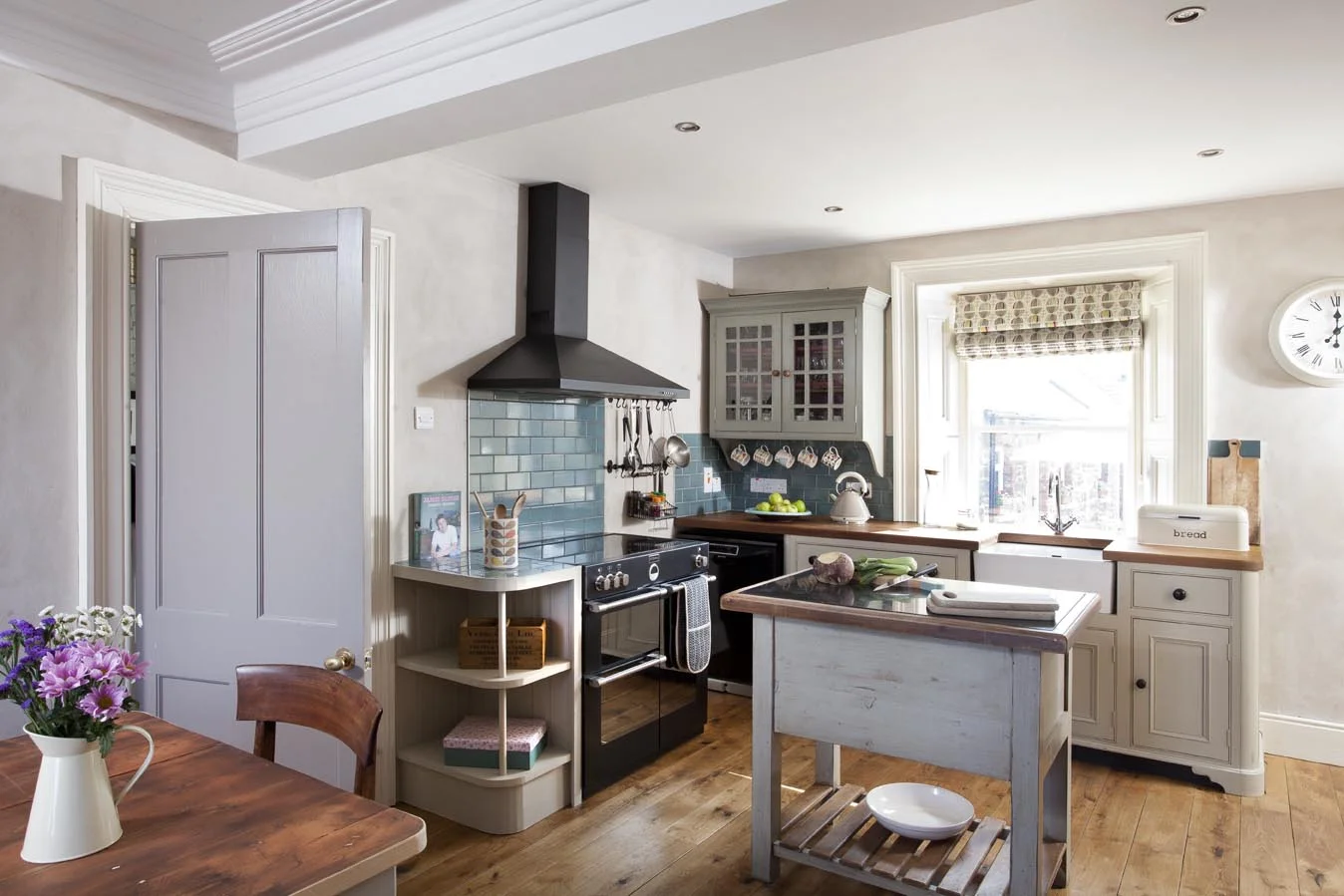 Hand painted, free standing kitchen units suited the house better than modern alternatives.