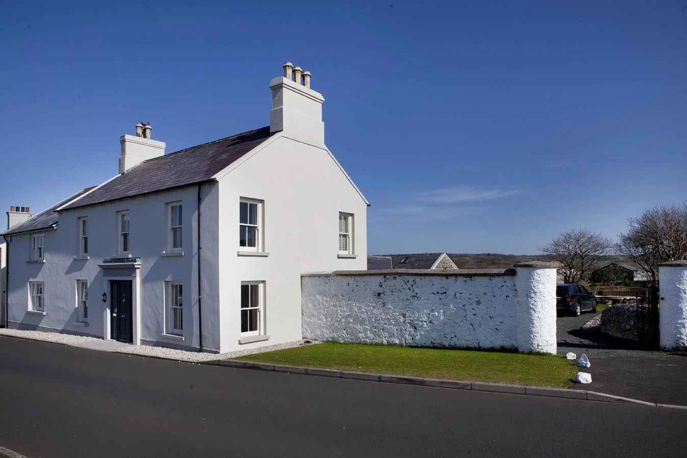 Strawbridge House...traditionally rendered and bright in the midday sun.