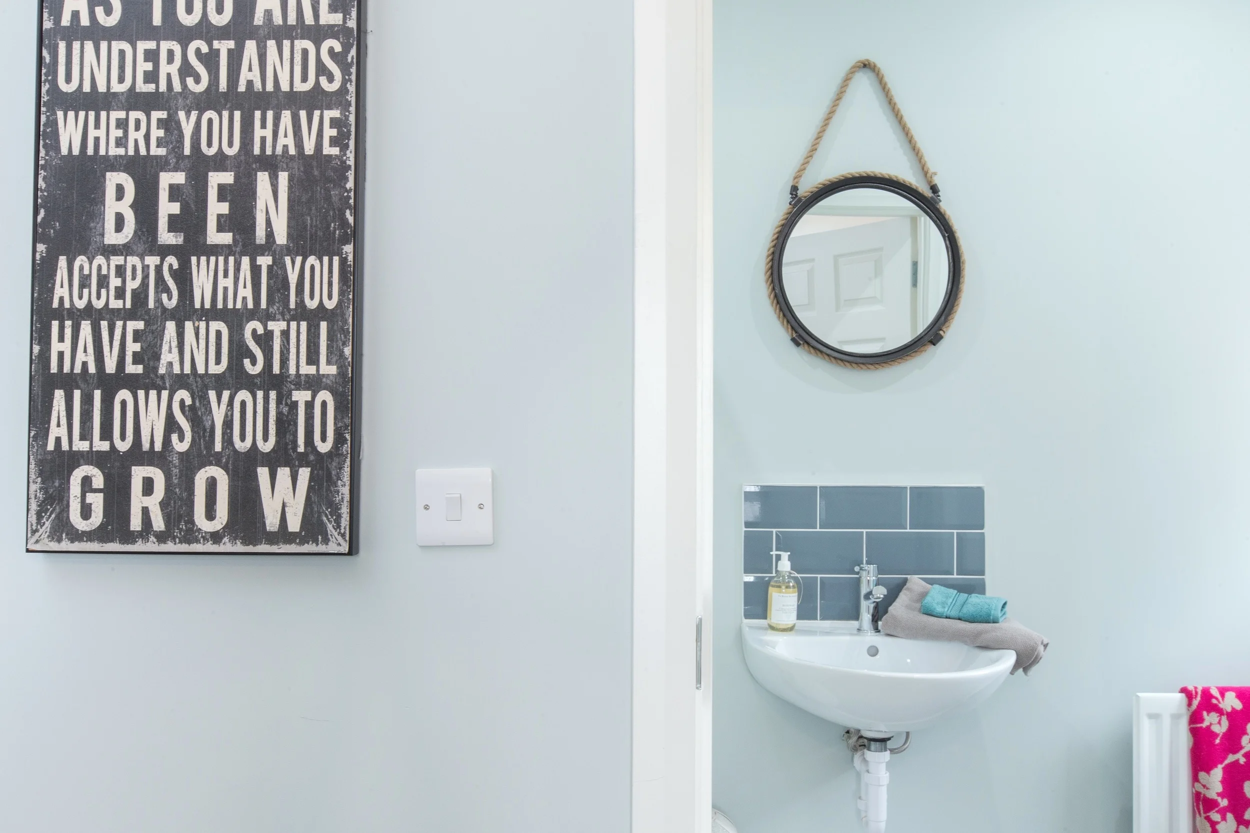A peek through the door to the en suite beyond, continuing the colour scheme and salvage theme.