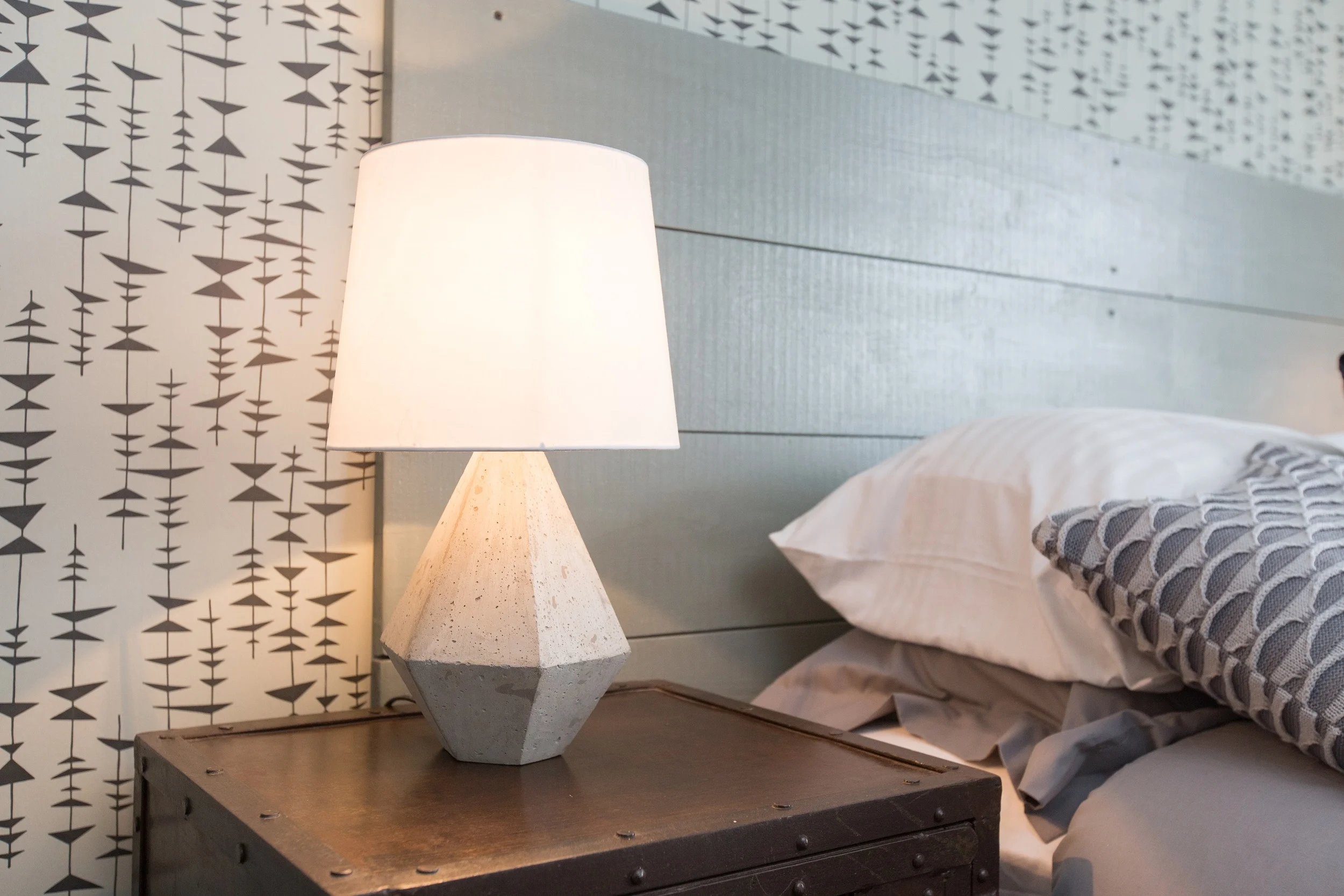 An inspired mix of wide wooden boards, raw concrete and rusted metal are combined with blue greys and cosy textures to create an unexpectedly soft finish.