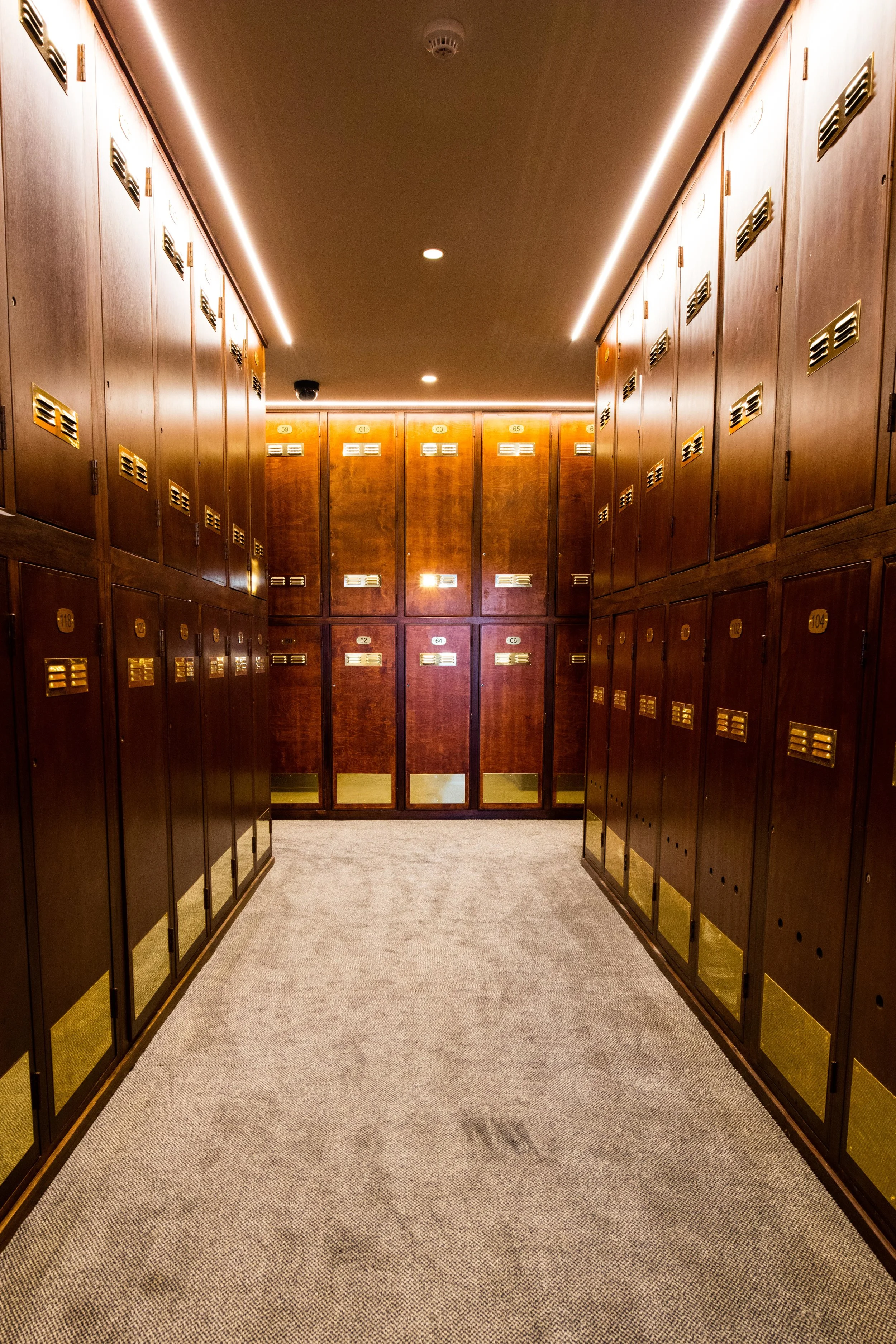 The original locker room suffered from a lack of lighting. The ceilings were replastered and designed to incorporate LED strip lights around the locker bays - not only providing illumination but also setting off the now pristine locker fronts in style.