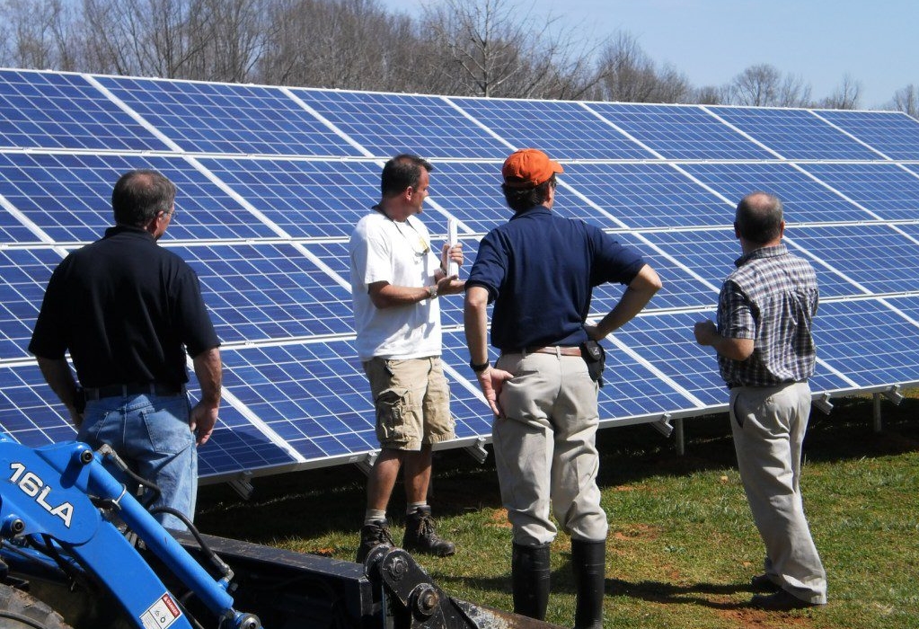 Bernie explains solar to inspectors from Powhatan.jpg